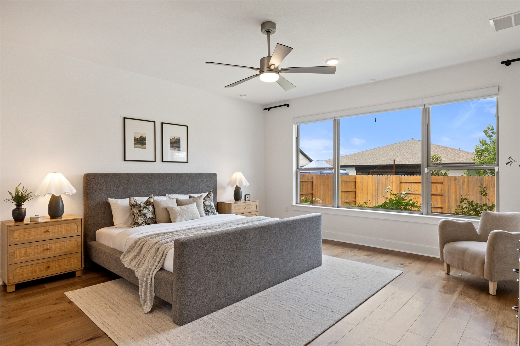 7908 Yokohama Terrace Austin, TX 78744 - Photo 5 of 40 a bedroom with a large bed and a large window