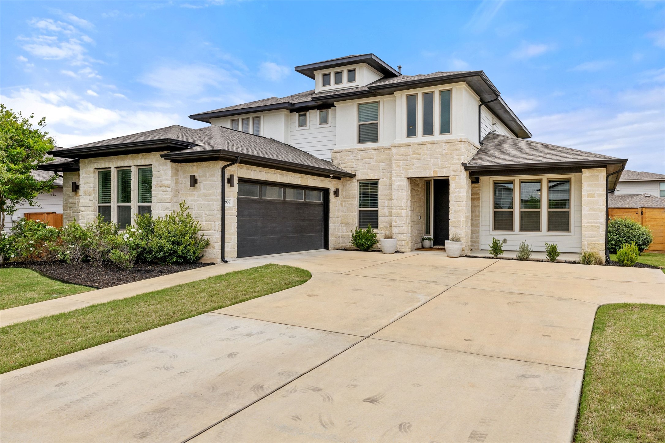 7908 Yokohama Terrace Austin, TX 78744 - Photo 7 of 40 a front view of a house with a yard and garage