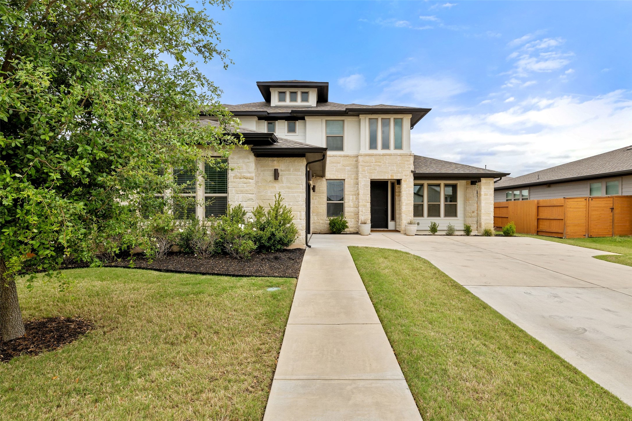 7908 Yokohama Terrace Austin, TX 78744 - Photo 9 of 40 a front view of a house with yard