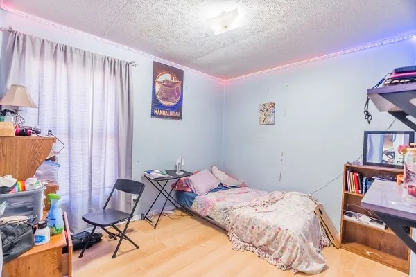 a bedroom with a bed and furniture