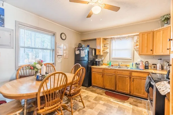 a dining room with furniture and window