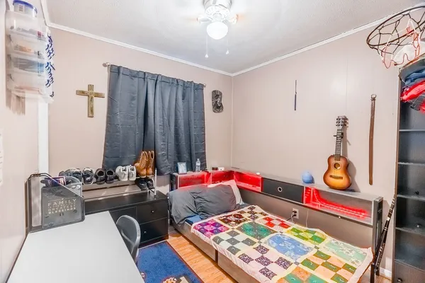 a bedroom with furniture and a rug