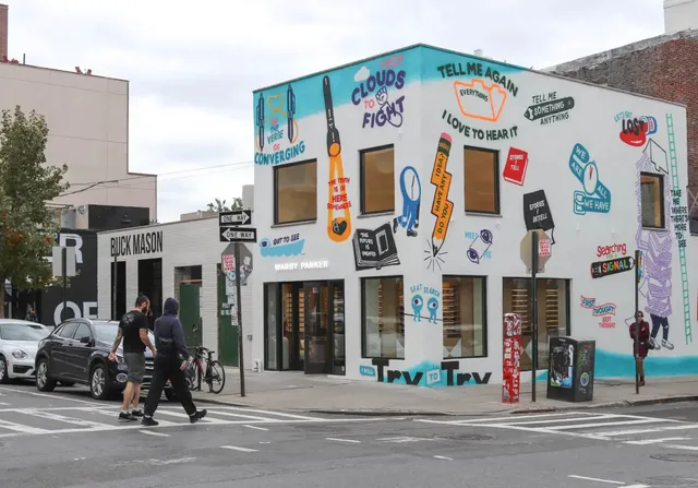 a view of a street with cars