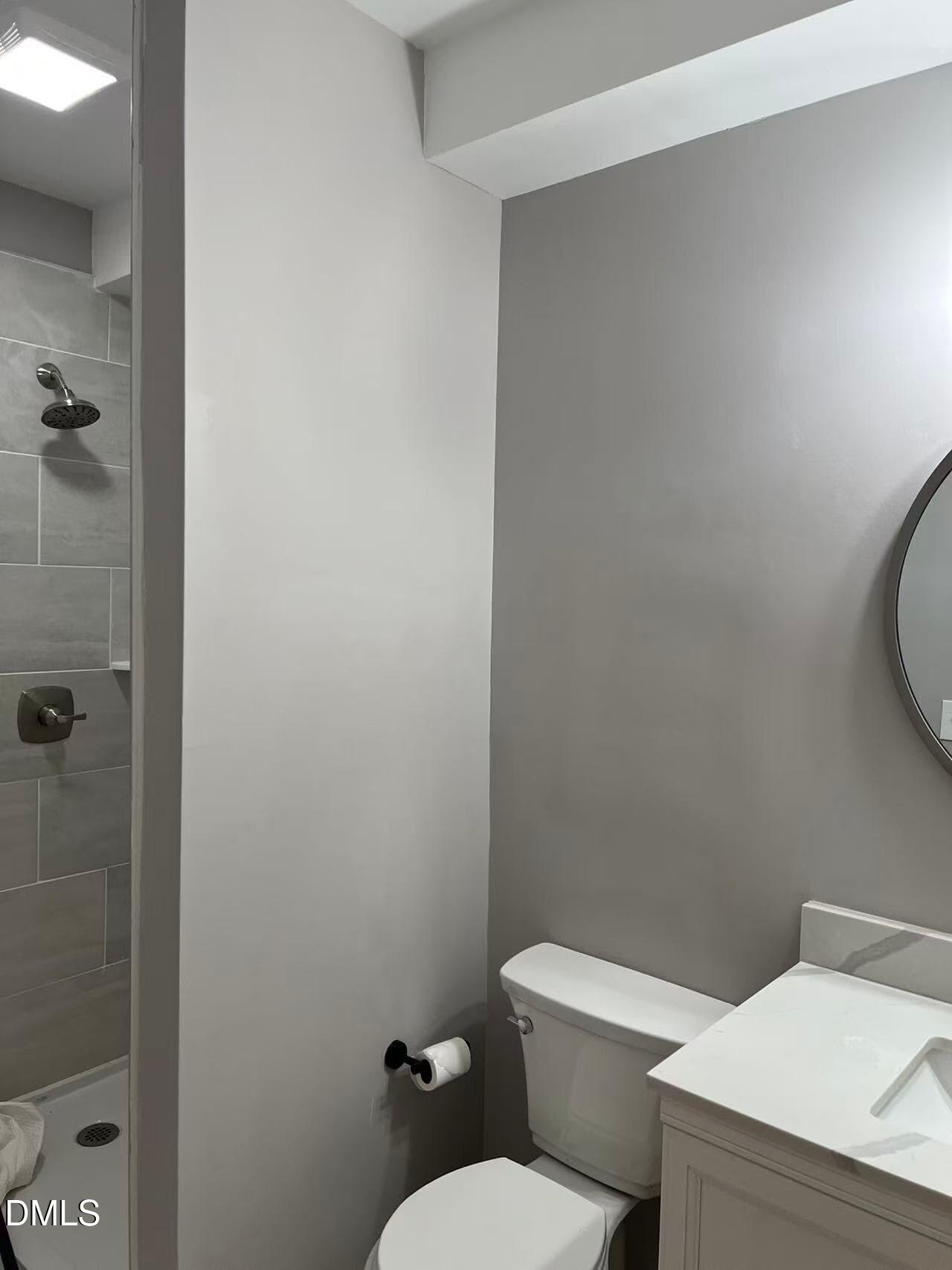 409 Rockingham Street Carthage, NC 28327 - Photo 29 of 56 a white toilet sitting next to a bathroom sink