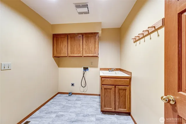 a view of storage and utility room with washer and dryer
