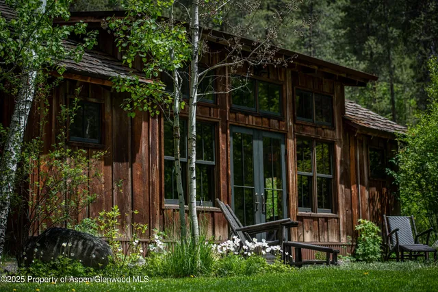 a view of a house with brick walls