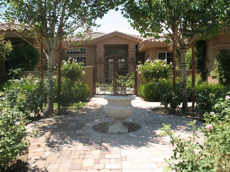 6 Varsity Circle Rancho Mirage, CA 92270 - Photo 1 of 21 a front view of a house with a yard