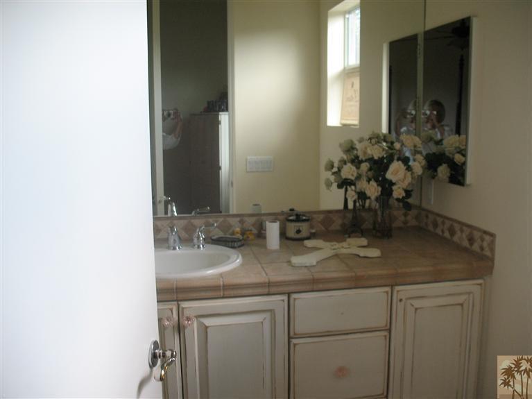 6 Varsity Circle Rancho Mirage, CA 92270 - Photo 12 of 21 a bathroom with a sink and a mirror