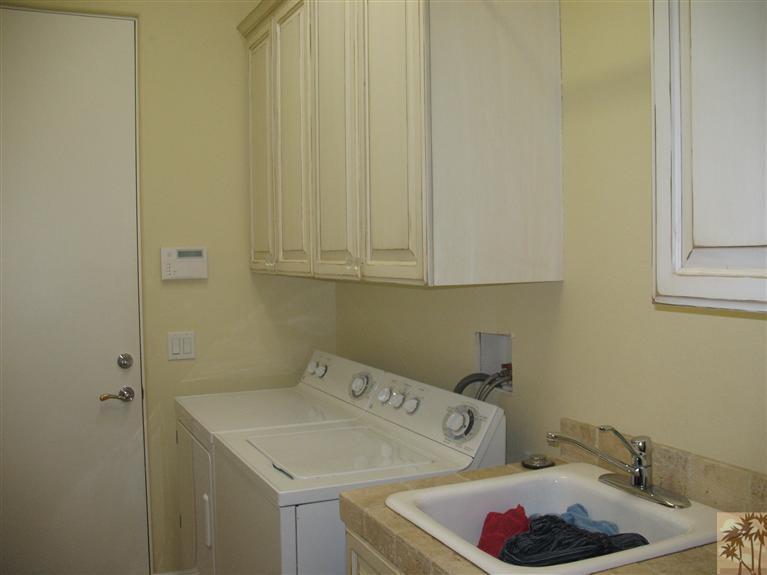 6 Varsity Circle Rancho Mirage, CA 92270 - Photo 13 of 21 a bathroom with a sink and cabinets