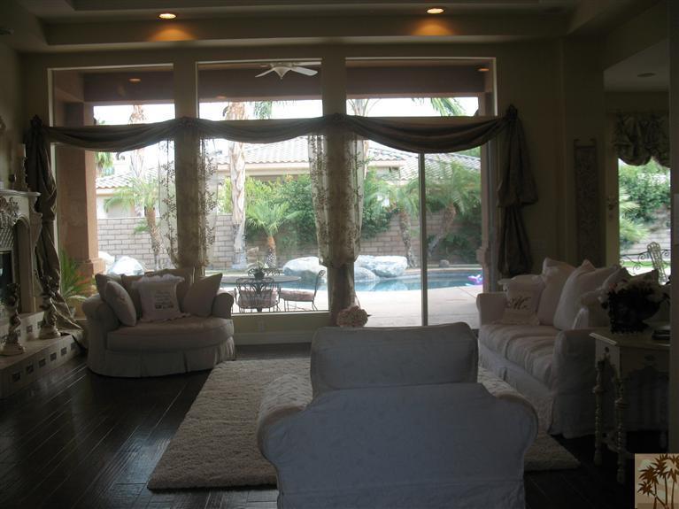 6 Varsity Circle Rancho Mirage, CA 92270 - Photo 3 of 21 a living room with furniture and a large window