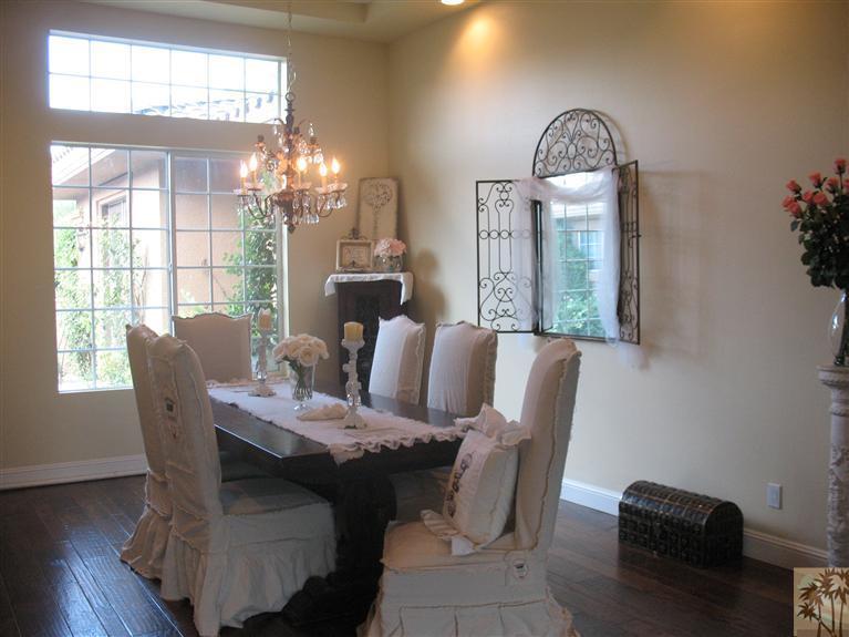 6 Varsity Circle Rancho Mirage, CA 92270 - Photo 4 of 21 a view of a dining room with furniture and chandelier