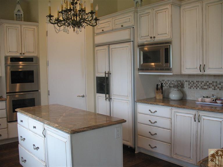 6 Varsity Circle Rancho Mirage, CA 92270 - Photo 5 of 21 a kitchen with white cabinets and sink