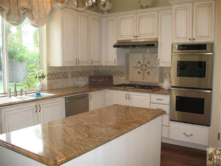 6 Varsity Circle Rancho Mirage, CA 92270 - Photo 6 of 21 a kitchen with granite countertop a sink stainless steel appliances and cabinets