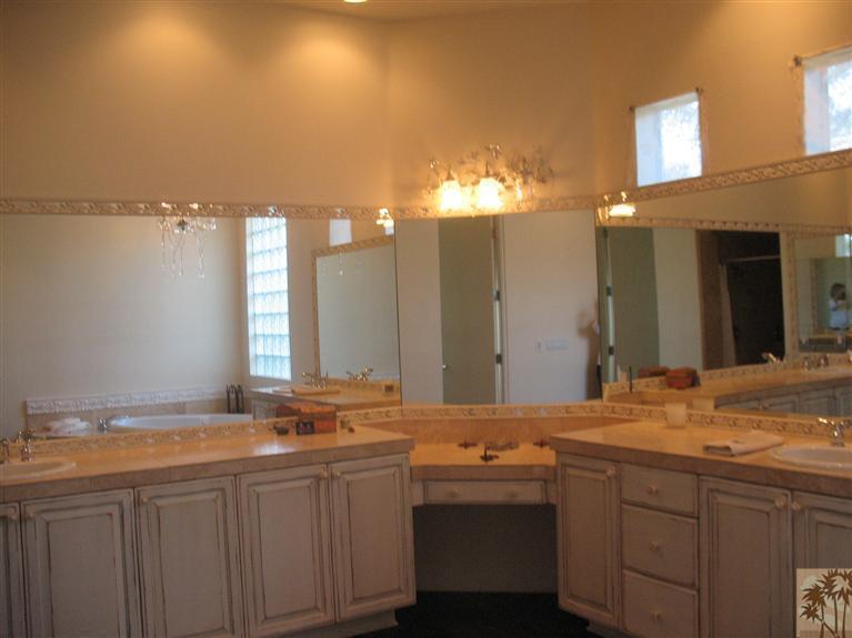 6 Varsity Circle Rancho Mirage, CA 92270 - Photo 10 of 21 a bathroom with a granite countertop sink and a mirror