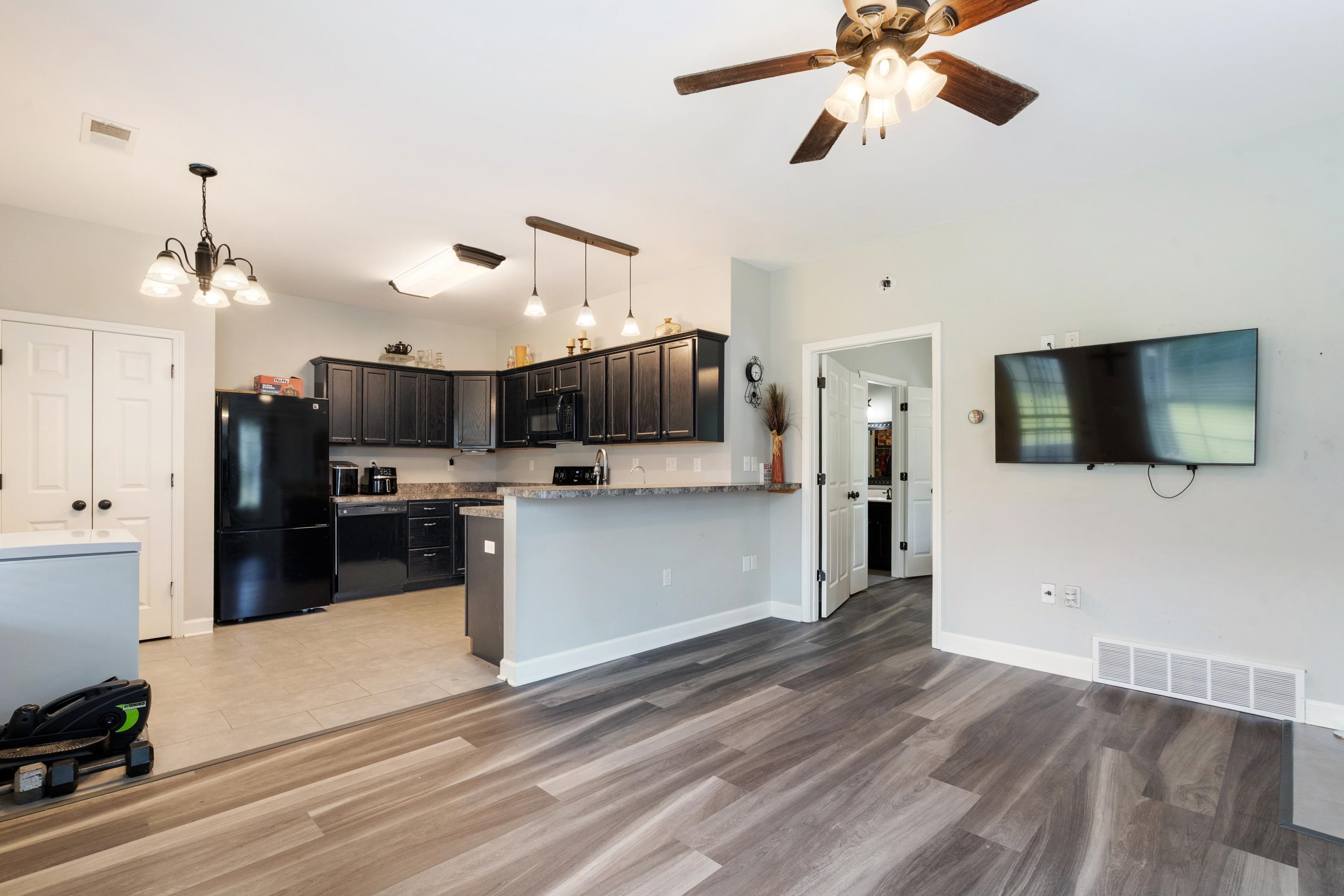 7757 Brunswick Road Millington, TN 38053 - Photo 24 of 40 Spacious open-concept area featuring wood-finish flooring