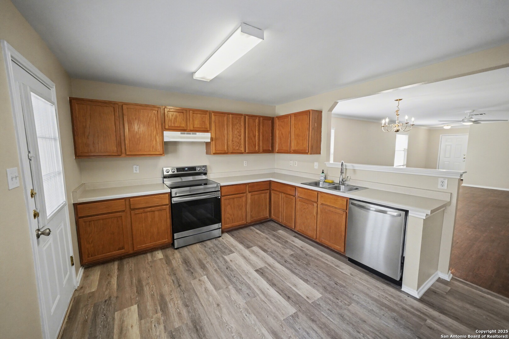 112 Stream Crossing Cibolo, TX 78108 - Photo 12 of 38 a kitchen with granite countertop a sink cabinets and stainless steel appliances