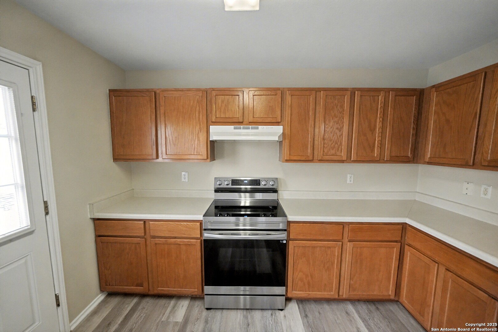 112 Stream Crossing Cibolo, TX 78108 - Photo 14 of 38 a kitchen with sink a stove and cabinets