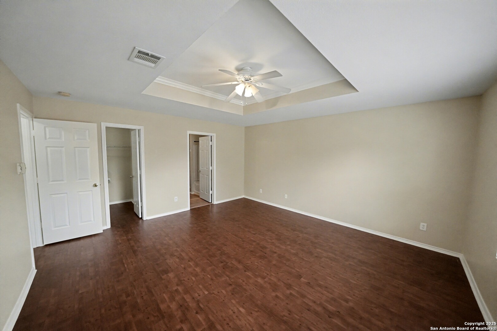 112 Stream Crossing Cibolo, TX 78108 - Photo 22 of 38 a view of an empty room with chandelier fan and wooden floor