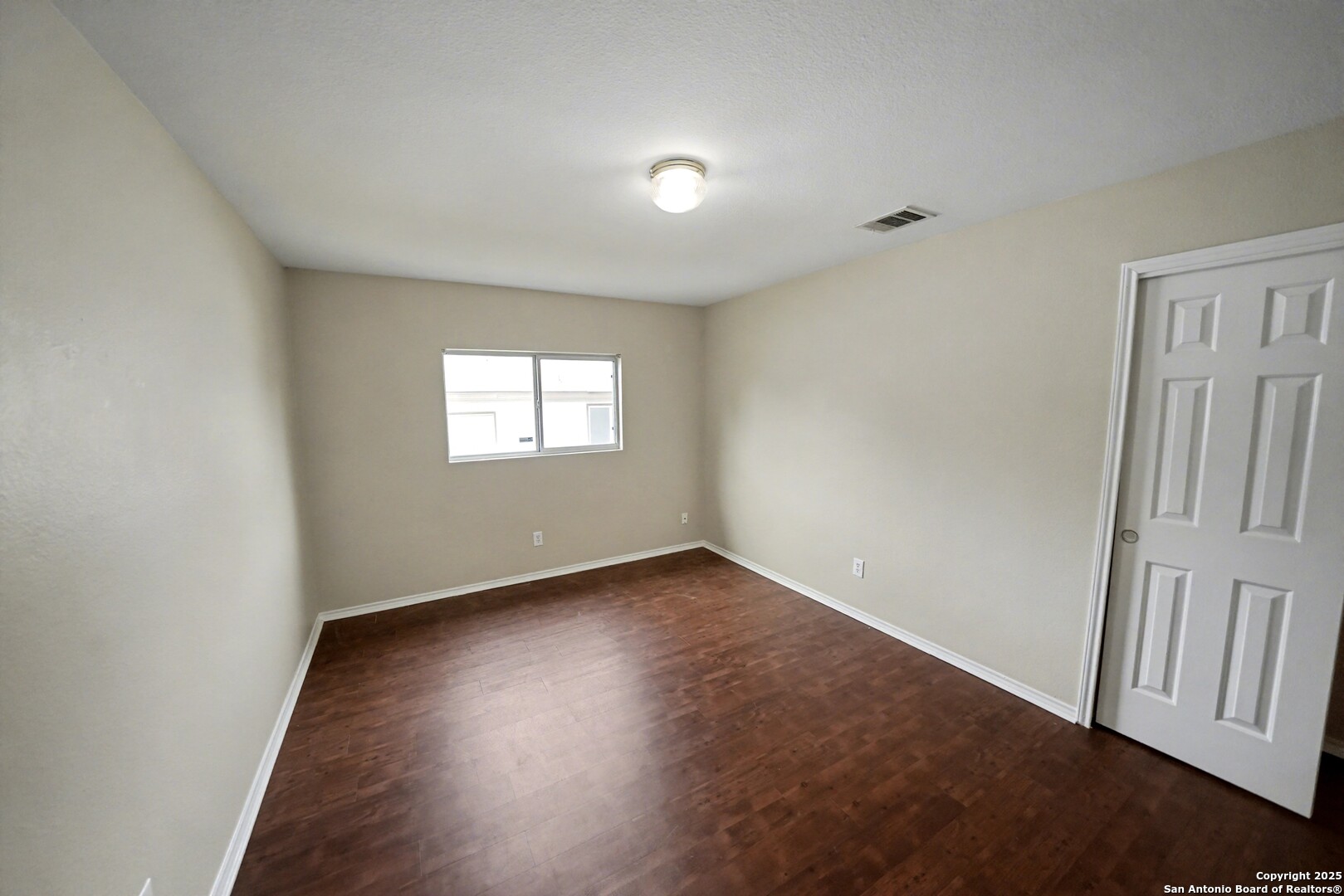 112 Stream Crossing Cibolo, TX 78108 - Photo 27 of 38 an empty room with wooden floor and windows