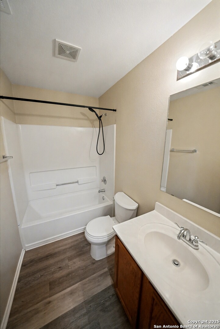112 Stream Crossing Cibolo, TX 78108 - Photo 29 of 38 a bathroom with a sink mirror vanity and toilet