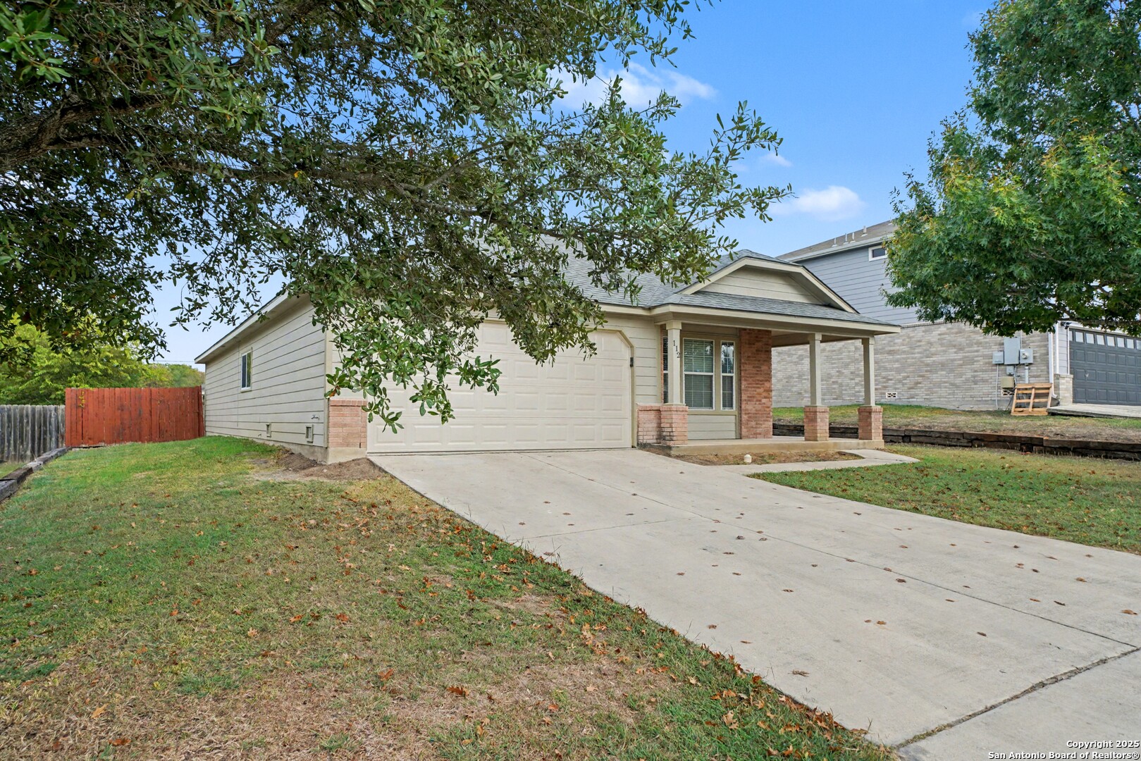 112 Stream Crossing Cibolo, TX 78108 - Photo 3 of 38 a front view of a house with a yard and garage