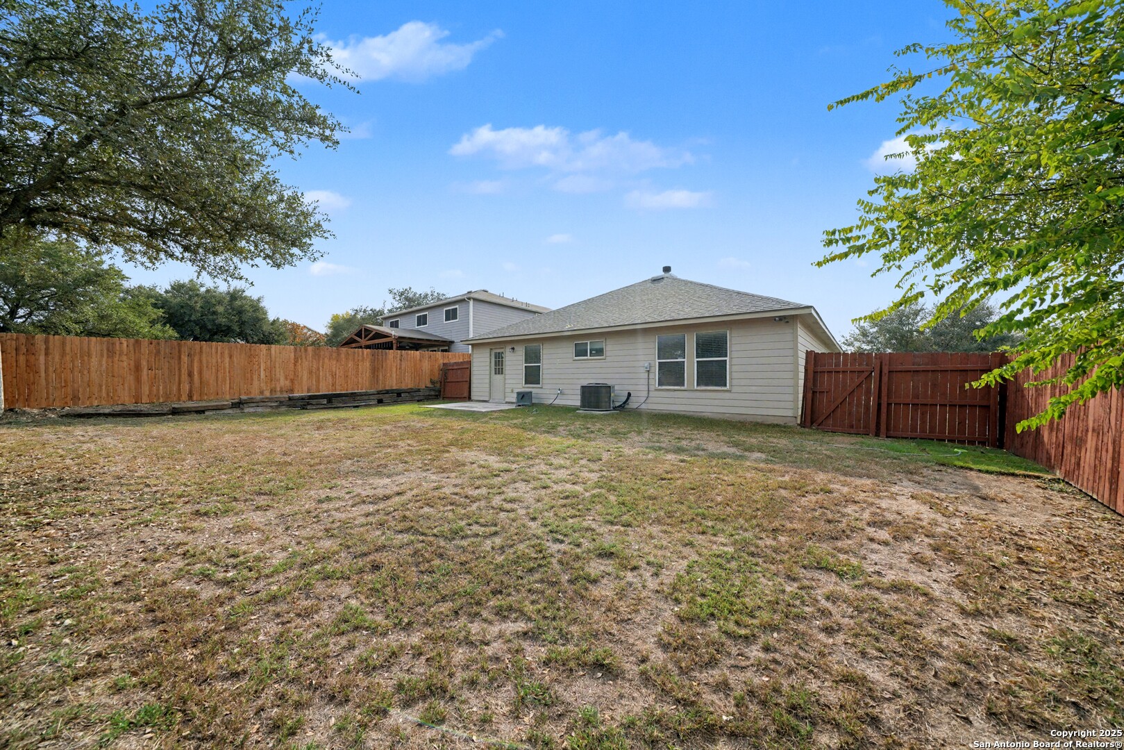 112 Stream Crossing Cibolo, TX 78108 - Photo 37 of 38 a front view of a house with a garden