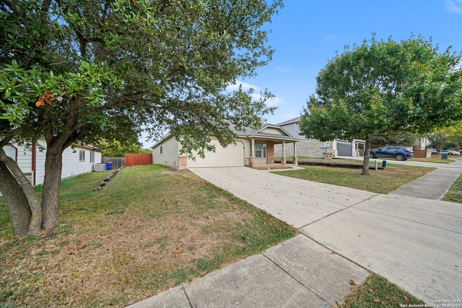 112 Stream Crossing Cibolo, TX 78108 - Photo 4 of 38 front view of a house with a yard