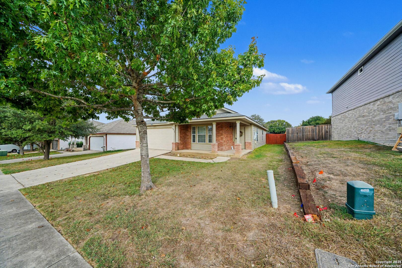 112 Stream Crossing Cibolo, TX 78108 - Photo 6 of 38 a house view with a backyard space