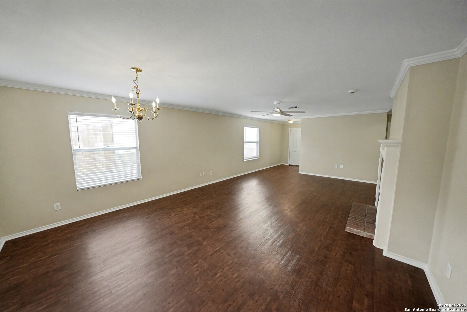 112 Stream Crossing Cibolo, TX 78108 - Photo 9 of 38 an empty room with wooden floor and windows