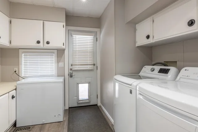 a kitchen with granite countertop a sink and cabinets