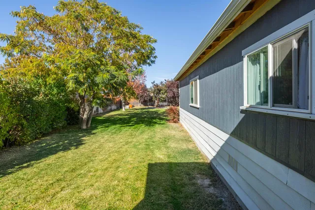 a view of a two chairs in the balcony