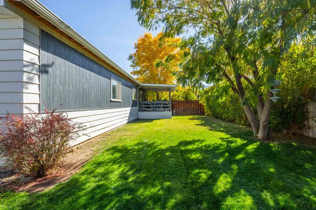 a view of house with backyard