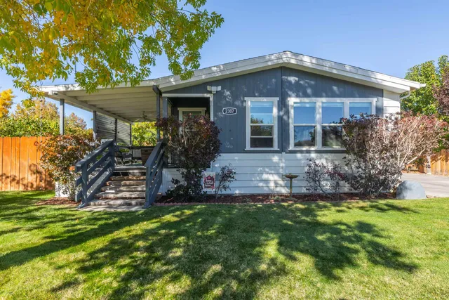 a front view of house with a garden