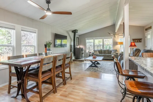 a view of a dining room with furniture window and outside view