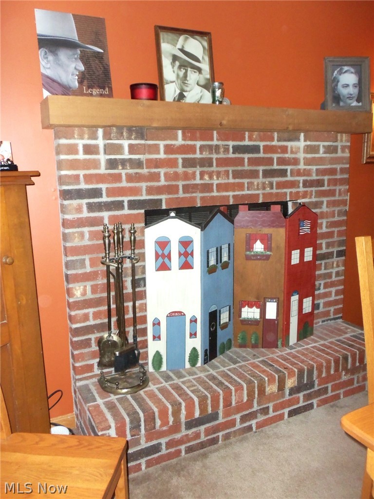 13760 Old State Road Middlefield, OH 44062 - Photo 7 of 18 Nice brick faced gas fireplace