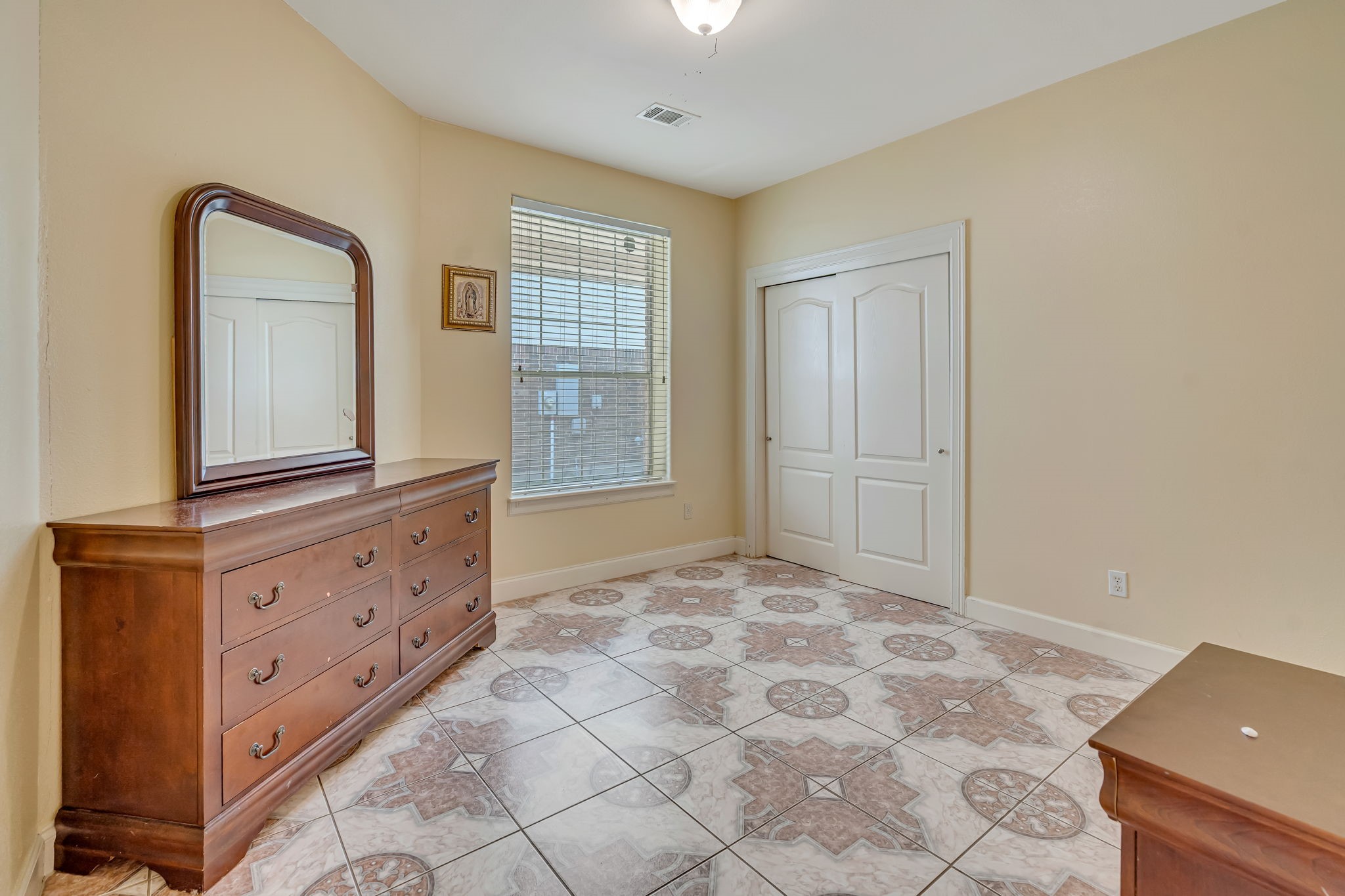 4810 Plum Forest Road Houston, TX 77084 - Photo 20 of 29 a view of room with window and wooden floor