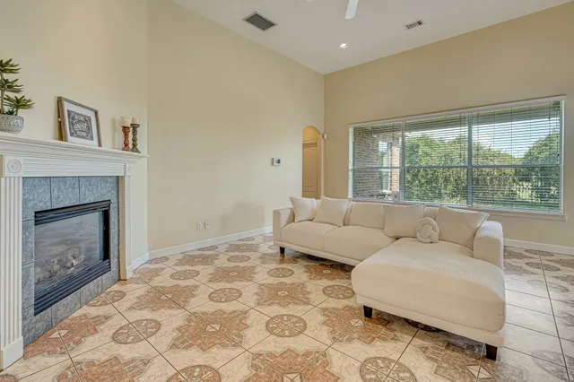 a living room with furniture and a fireplace
