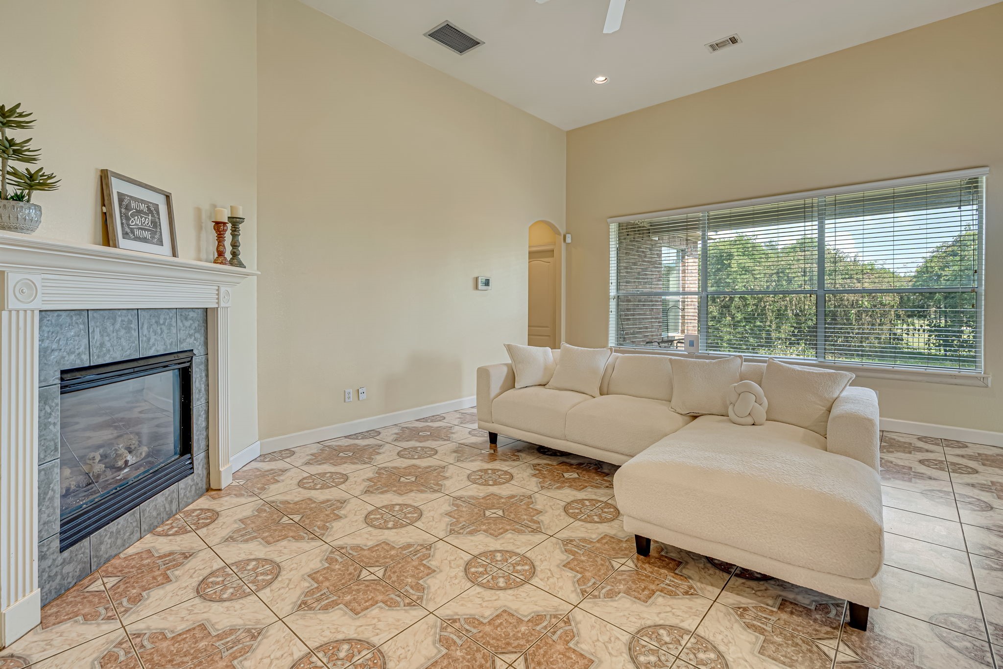 4810 Plum Forest Road Houston, TX 77084 - Photo 2 of 29 a living room with furniture and a fireplace