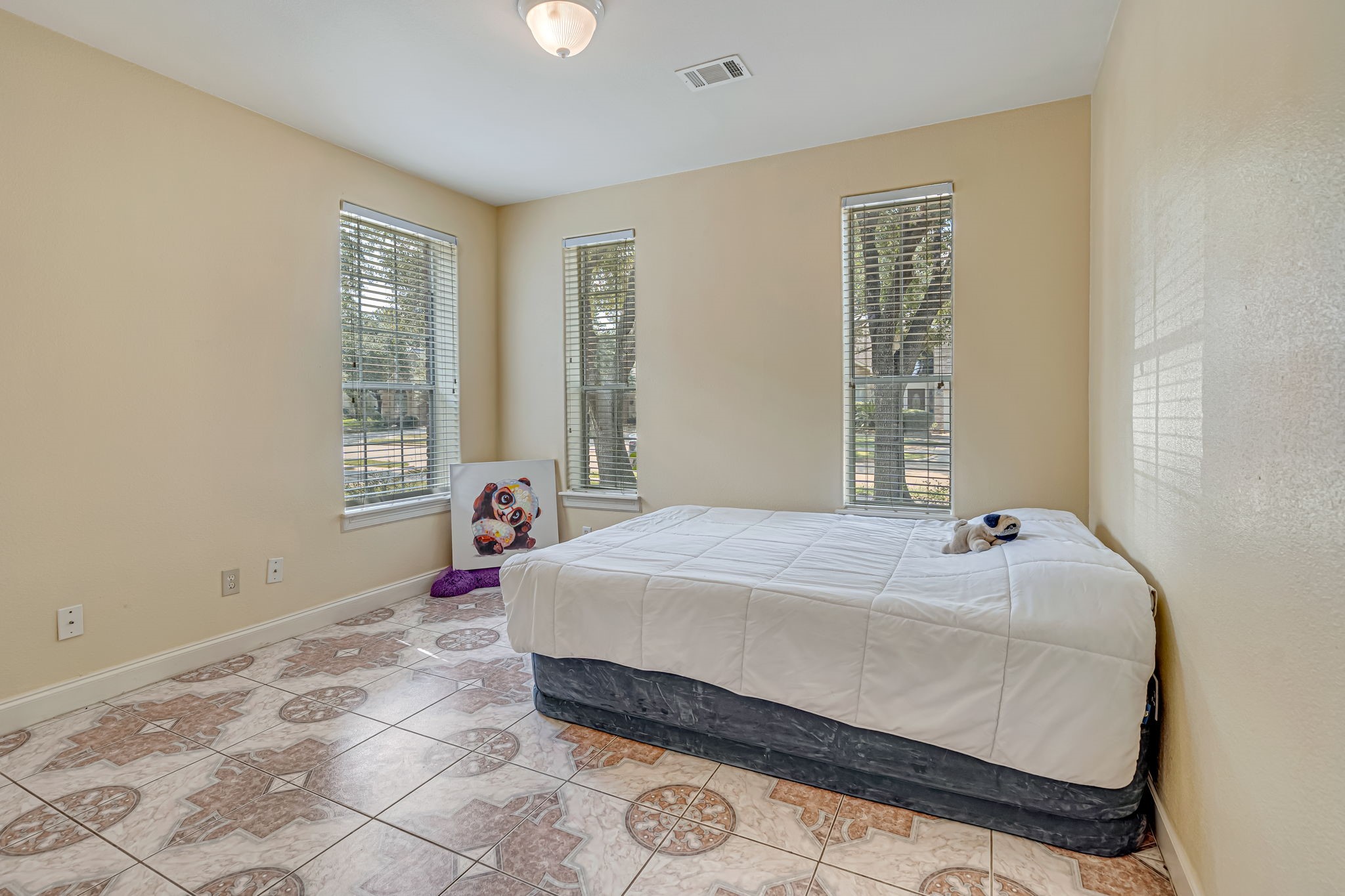 4810 Plum Forest Road Houston, TX 77084 - Photo 21 of 29 a bedroom with a bed and a window
