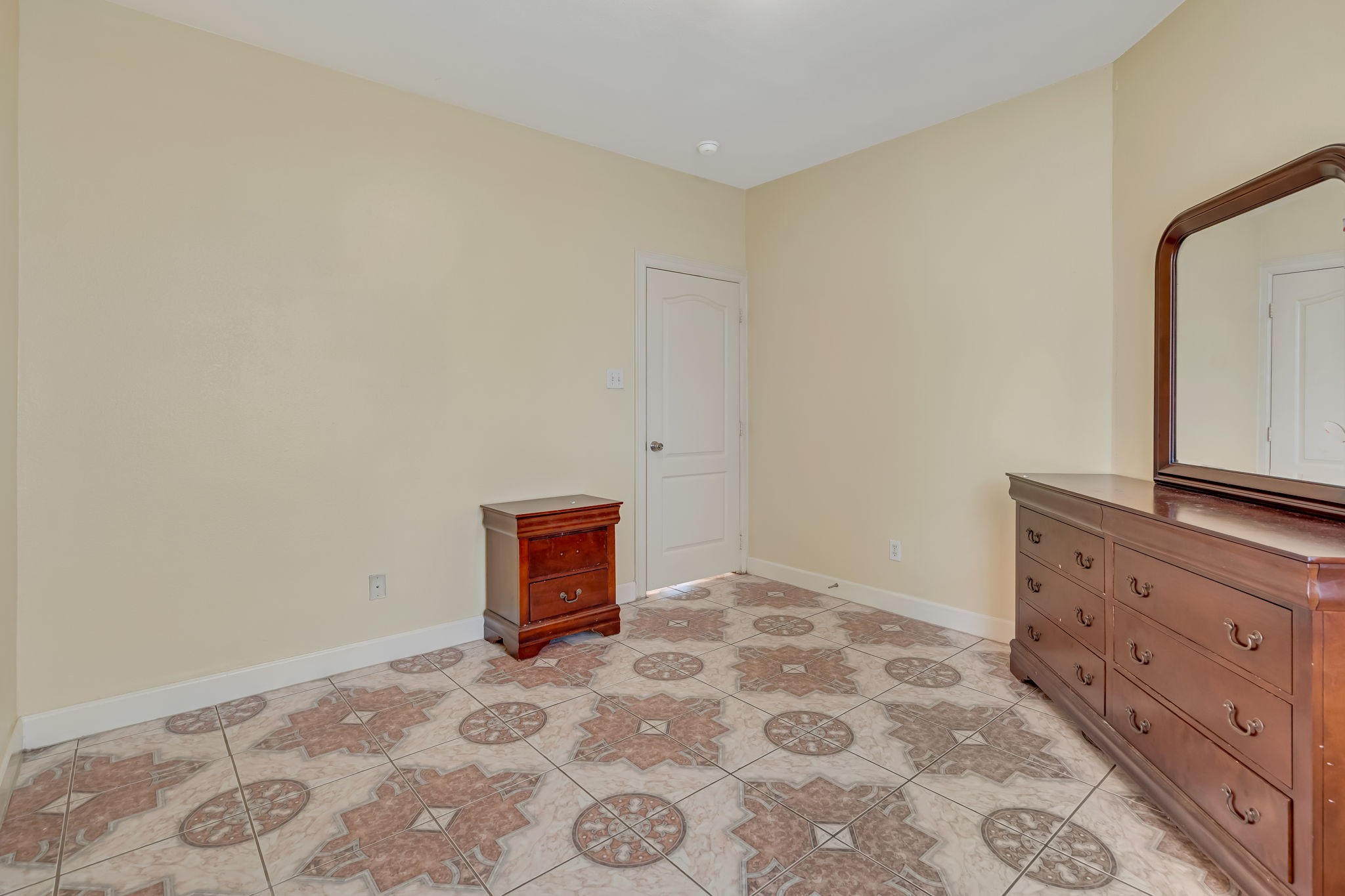 4810 Plum Forest Road Houston, TX 77084 - Photo 22 of 29 a bedroom with a bed and a dresser in it