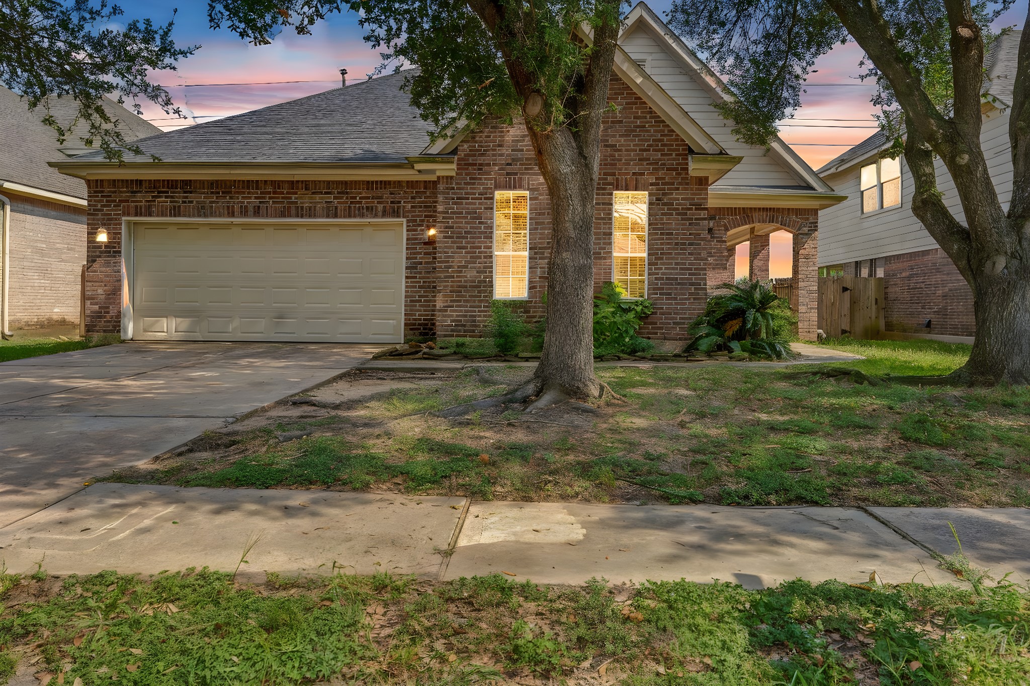 4810 Plum Forest Road Houston, TX 77084 - Photo 25 of 29 a front view of a house with a yard and garage