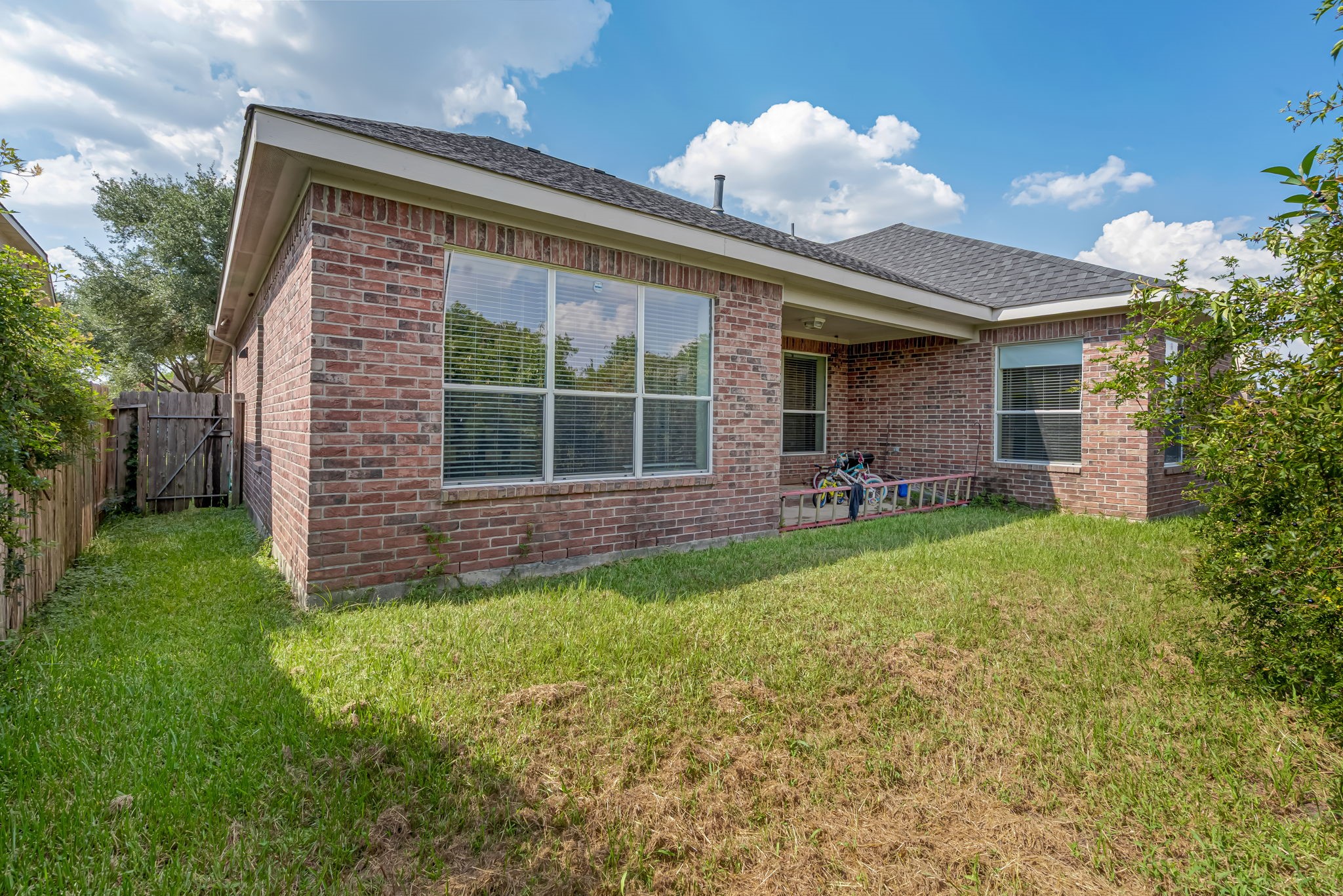 4810 Plum Forest Road Houston, TX 77084 - Photo 27 of 29 a front view of a house with a garden