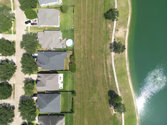 aerial view of a house with a yard