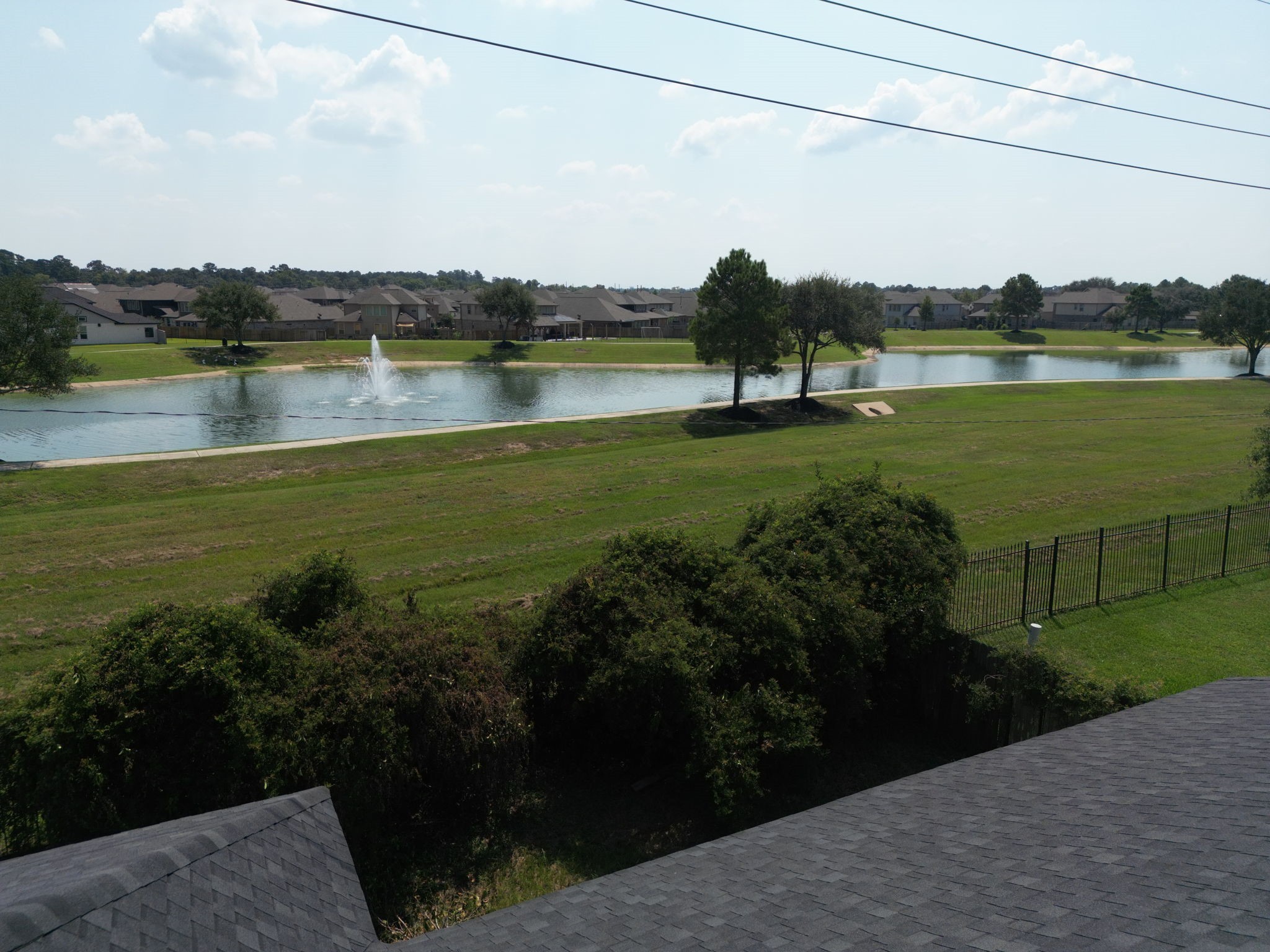 4810 Plum Forest Road Houston, TX 77084 - Photo 6 of 29 a view of a lake with houses in the back