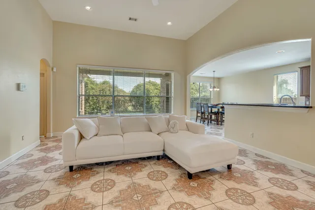 a living room with furniture and a large window