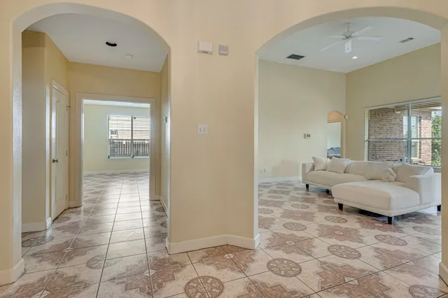 a spacious bedroom with a bed and a sink
