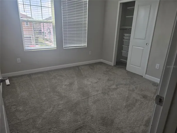 a view of an empty room with a window