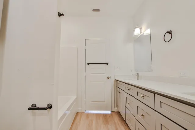 a kitchen with a sink and cabinets