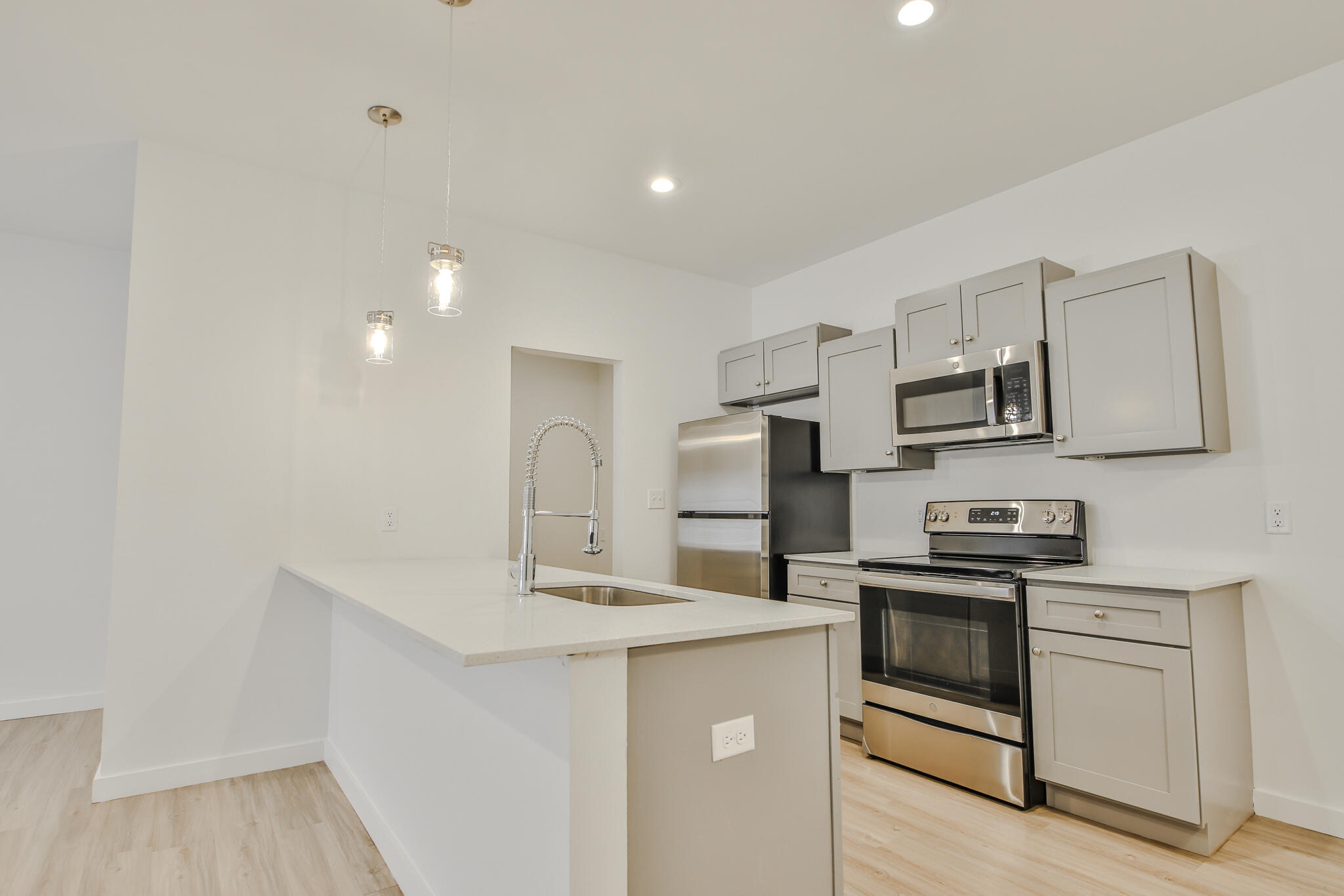 5506 Itasca Street Lubbock, TX 79416 - Photo 4 of 15 a kitchen with stainless steel appliances granite countertop a sink stove and refrigerator