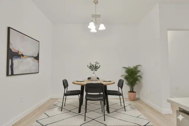 a dining room with furniture and window